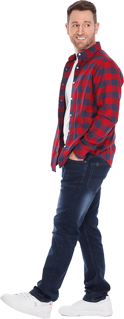 Person wearing a red and black checkered shirt with blue jeans.