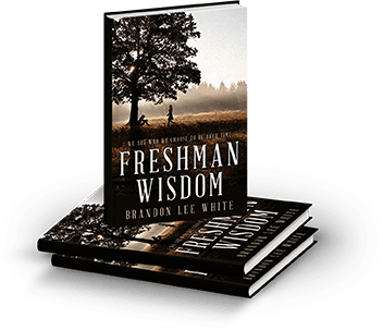 Stack of 'Freshman Wisdom' books with a serene tree landscape cover.