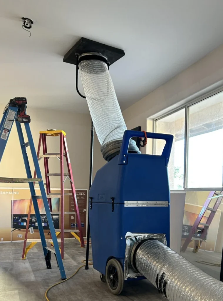 Negative air machine attached to ceiling