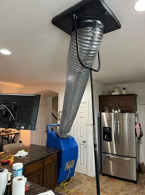 Negative air machine attached to ceiling