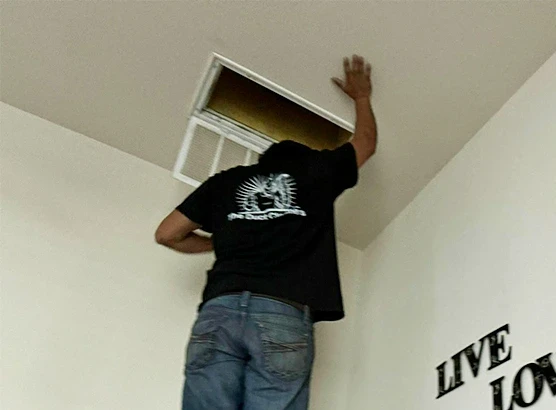 The duct cleaners technician cleaning air duct