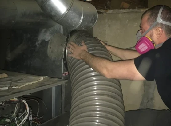a technician performing maintenance of a HVAC system
